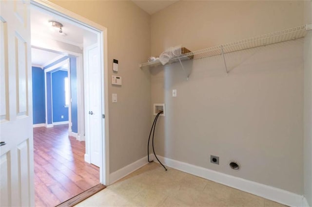 laundry area with hookup for a washing machine and hookup for an electric dryer