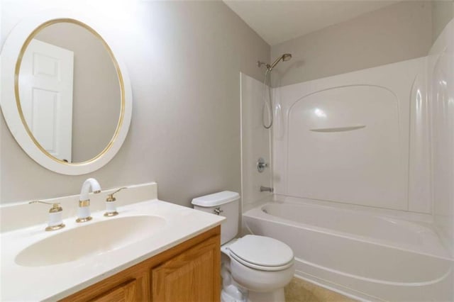 full bathroom featuring vanity, bathtub / shower combination, and toilet