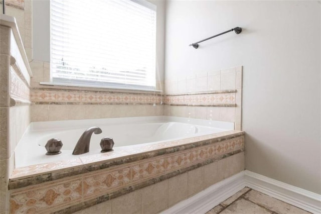 bathroom featuring tiled tub