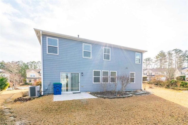 back of property featuring a patio, a yard, and cooling unit