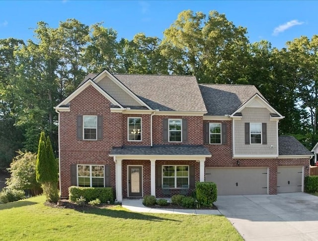 211 Parc Dr, Canton, GA 30114 - craftsman house featuring driveway, brick siding, a front lawn, a shingled roof, and an attached garage