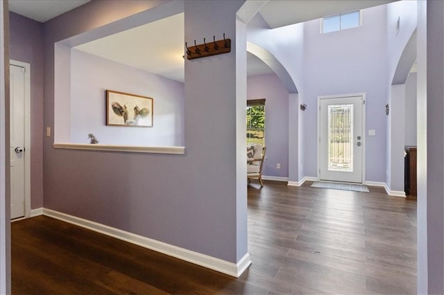 211 Parc Dr, Canton, GA 30114 - entryway with arched walkways, dark wood-type flooring, and baseboards