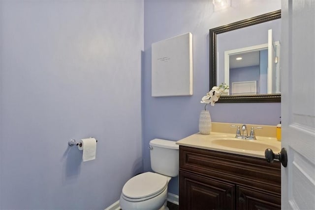 211 Parc Dr, Canton, GA 30114 - half bath featuring toilet, vanity, and baseboards