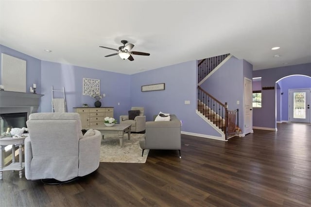 211 Parc Dr, Canton, GA 30114 - living area with stairway, dark wood-type flooring, a glass covered fireplace, ceiling fan, and recessed lighting