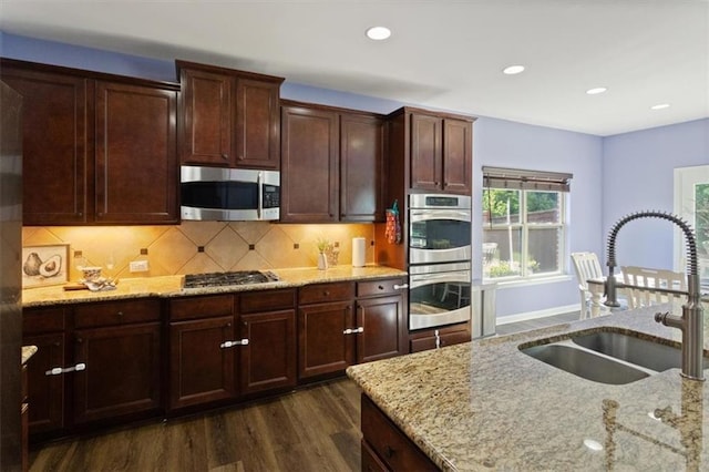 211 Parc Dr, Canton, GA 30114 - kitchen with appliances with stainless steel finishes, a sink, dark wood-style floors, light stone counters, and recessed lighting