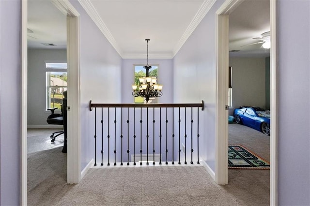 211 Parc Dr, Canton, GA 30114 - hallway featuring carpet, a chandelier, crown molding, baseboards, and an upstairs landing