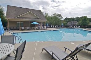 211 Parc Dr, Canton, GA 30114 - community pool with a patio area