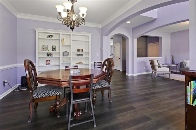 211 Parc Dr, Canton, GA 30114 - dining space featuring arched walkways, a chandelier, baseboards, dark wood finished floors, and ornamental molding