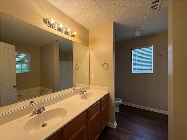 425 Bell Flower Trl, Locust Grove, GA 30248 - bathroom with wood finished floors, double vanity, and a bath