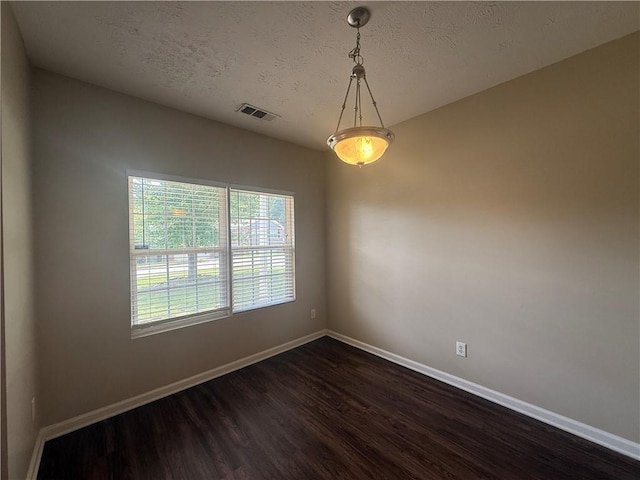 425 Bell Flower Trl, Locust Grove, GA 30248 - empty room featuring dark wood-type flooring and a textured ceiling
