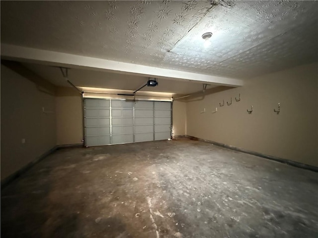 425 Bell Flower Trl, Locust Grove, GA 30248 - garage featuring a garage door opener and baseboards