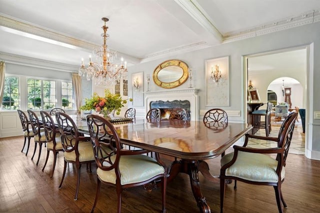 675 W Paces Ferry Rd NW Unit 11, Atlanta, GA 30327 - dining space featuring arched walkways, ornamental molding, an inviting chandelier, and wood finished floors