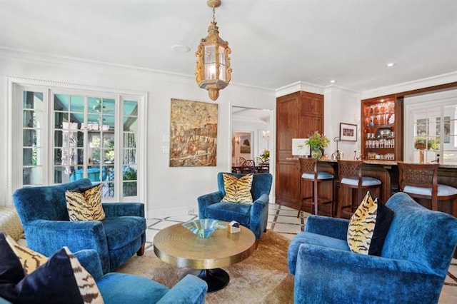 675 W Paces Ferry Rd NW Unit 11, Atlanta, GA 30327 - living area featuring baseboards, ornamental molding, plenty of natural light, and indoor wet bar