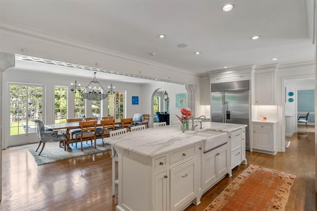 675 W Paces Ferry Rd NW Unit 11, Atlanta, GA 30327 - kitchen with a sink, crown molding, plenty of natural light, and a chandelier