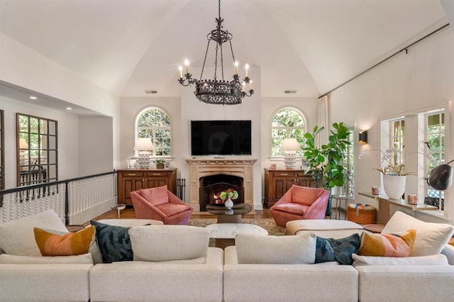 675 W Paces Ferry Rd NW Unit 11, Atlanta, GA 30327 - living area with an inviting chandelier, high vaulted ceiling, a healthy amount of sunlight, and visible vents
