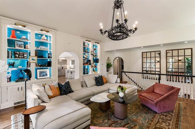 675 W Paces Ferry Rd NW Unit 11, Atlanta, GA 30327 - living room with recessed lighting, an inviting chandelier, visible vents, wood finished floors, and arched walkways