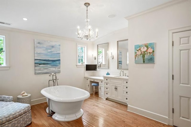 675 W Paces Ferry Rd NW Unit 11, Atlanta, GA 30327 - full bathroom featuring wood finished floors, visible vents, crown molding, a soaking tub, and baseboards