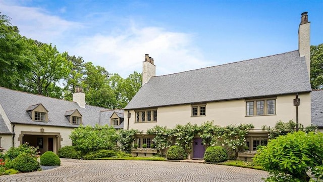 675 W Paces Ferry Rd NW Unit 11, Atlanta, GA 30327 - view of front facade featuring stucco siding and a chimney