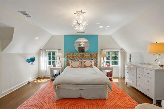 675 W Paces Ferry Rd NW Unit 11, Atlanta, GA 30327 - bedroom featuring vaulted ceiling, a notable chandelier, visible vents, and wood finished floors