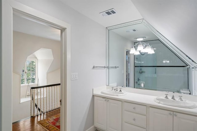 675 W Paces Ferry Rd NW Unit 11, Atlanta, GA 30327 - full bath featuring a sink, double vanity, visible vents, and wood finished floors