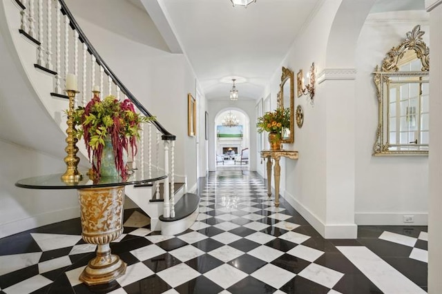 675 W Paces Ferry Rd NW Unit 11, Atlanta, GA 30327 - entrance foyer with baseboards, a notable chandelier, and stairway