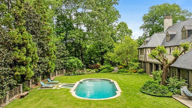 675 W Paces Ferry Rd NW Unit 11, Atlanta, GA 30327 - view of pool with a yard, a fenced backyard, and a pool with connected hot tub