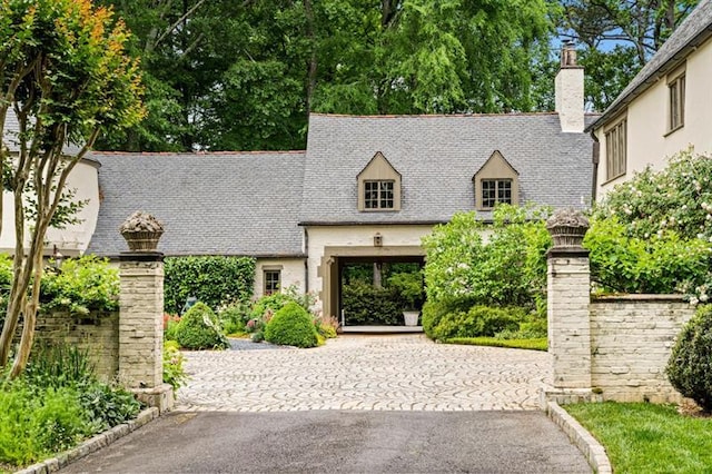 675 W Paces Ferry Rd NW Unit 11, Atlanta, GA 30327 - view of front facade with a chimney and driveway