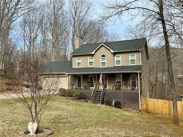 view of front of house with covered porch, a garage, stairway, a chimney, and a front yard