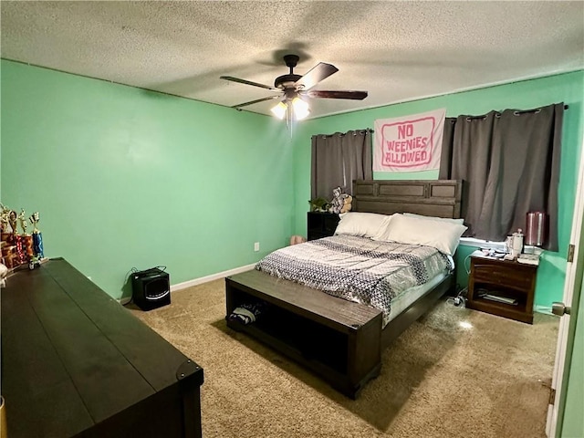 bedroom with baseboards, a ceiling fan, a textured ceiling, and carpet flooring