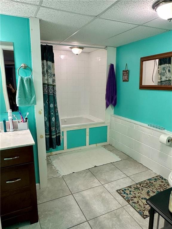 full bathroom featuring toilet, vanity, tiled shower / bath, and tile patterned floors