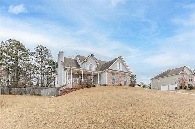 view of front of home featuring a front yard and covered porch