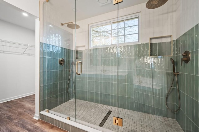 bathroom with hardwood / wood-style floors and walk in shower