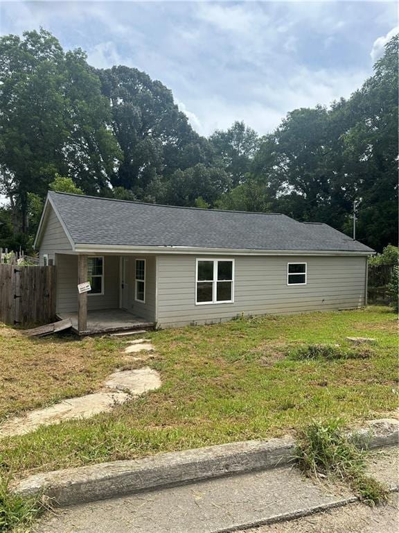 ranch-style home with a front lawn