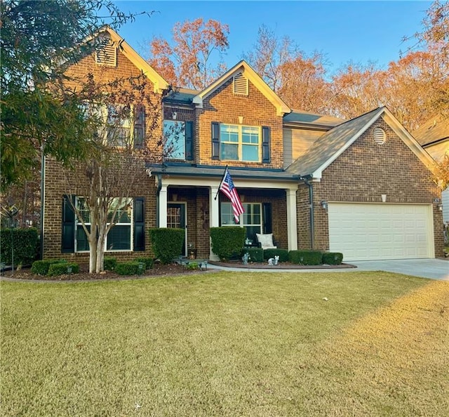 view of front of house featuring a garage and a front yard