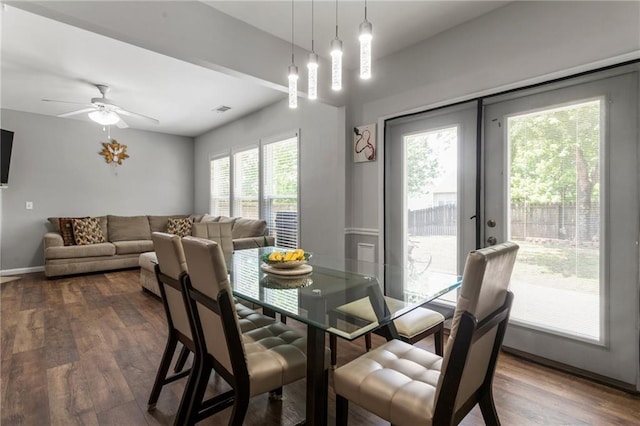 dining space with visible vents, baseboards, ceiling fan, french doors, and dark wood finished floors
