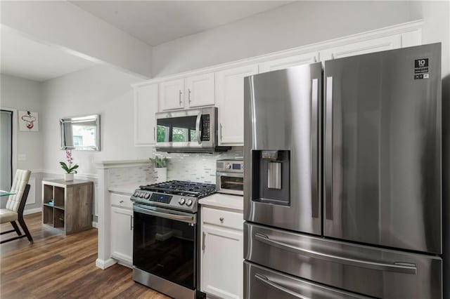 kitchen featuring backsplash, light countertops, dark wood-style floors, stainless steel appliances, and white cabinetry