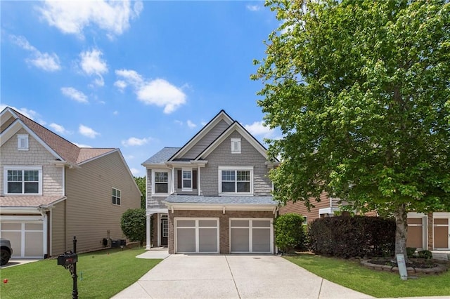 view of front facade featuring brick siding, an attached garage, driveway, and a front yard