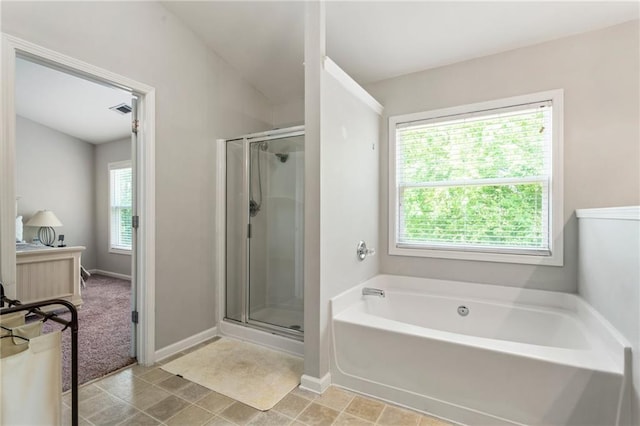 full bath with baseboards, a shower stall, a bath, and visible vents