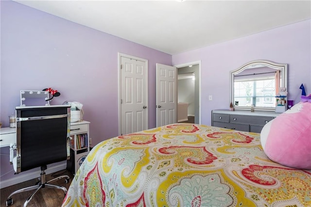 bedroom with wood finished floors