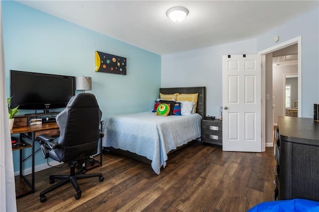 bedroom featuring dark wood-style flooring