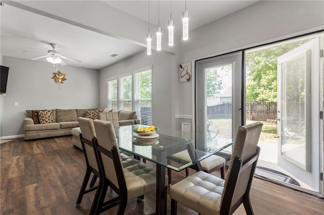 dining area with visible vents, dark wood finished floors, ceiling fan, and baseboards