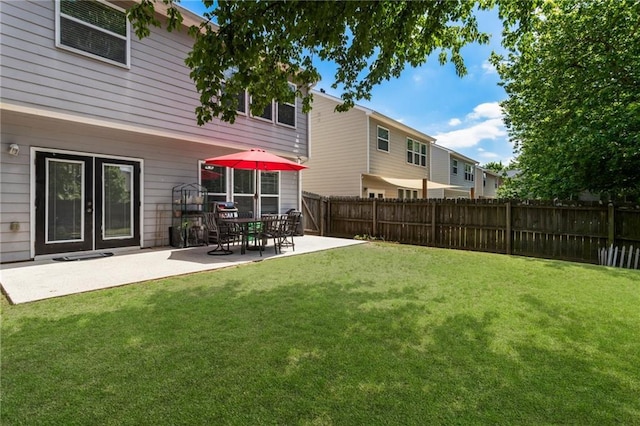 view of yard with fence and a patio area