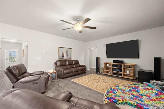 living room with ceiling fan and hardwood / wood-style flooring