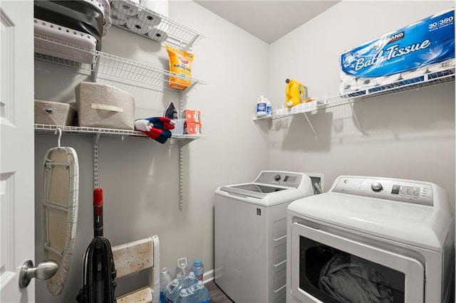 washroom featuring washing machine and clothes dryer