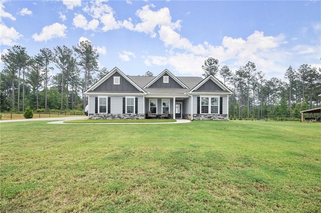 craftsman-style house with a front lawn