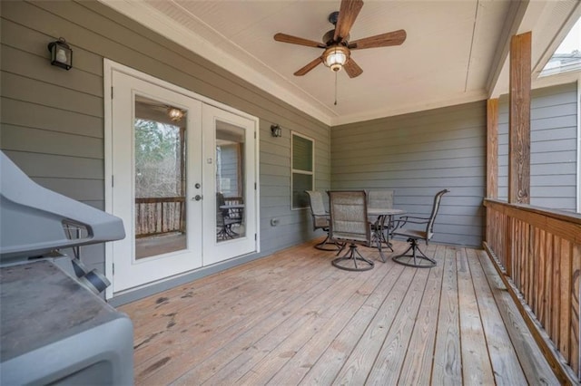 deck with french doors and ceiling fan