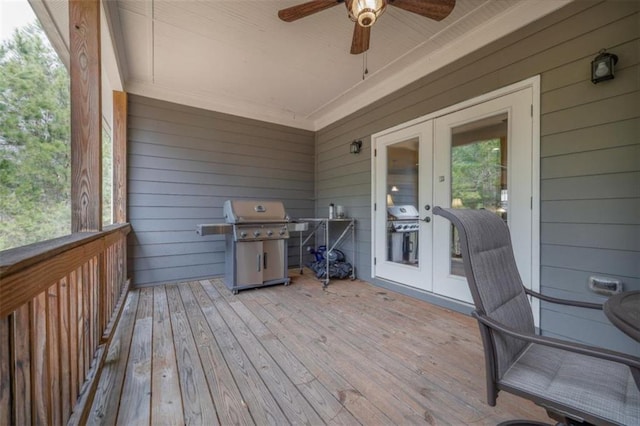 deck featuring area for grilling, ceiling fan, and french doors