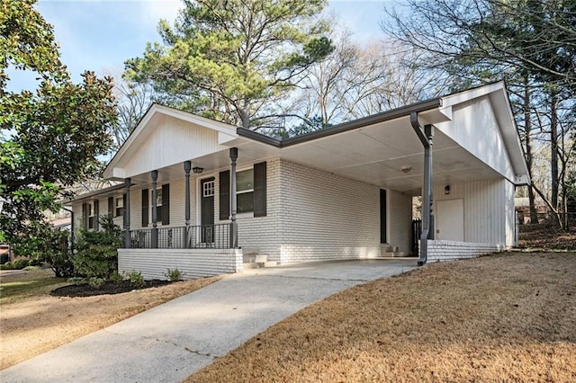 view of front of property with a porch and a carport