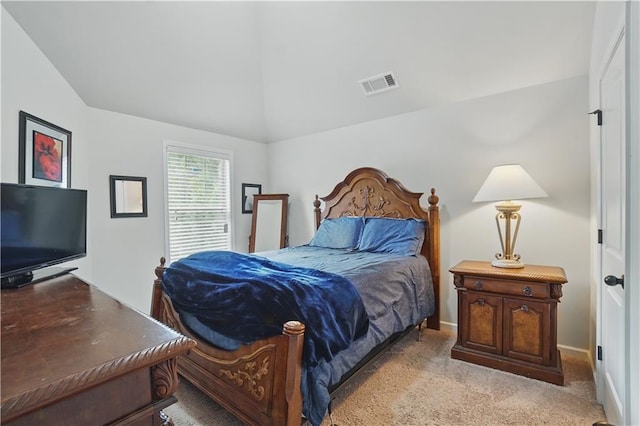 carpeted bedroom featuring lofted ceiling and visible vents