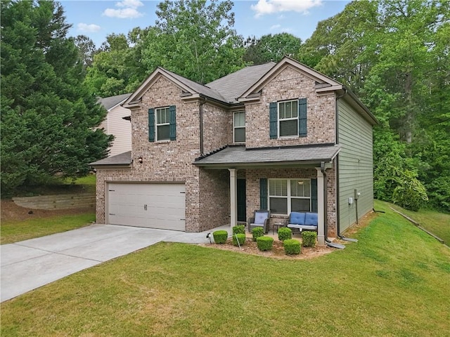 craftsman-style house with brick siding, a garage, a front yard, concrete driveway, and covered porch